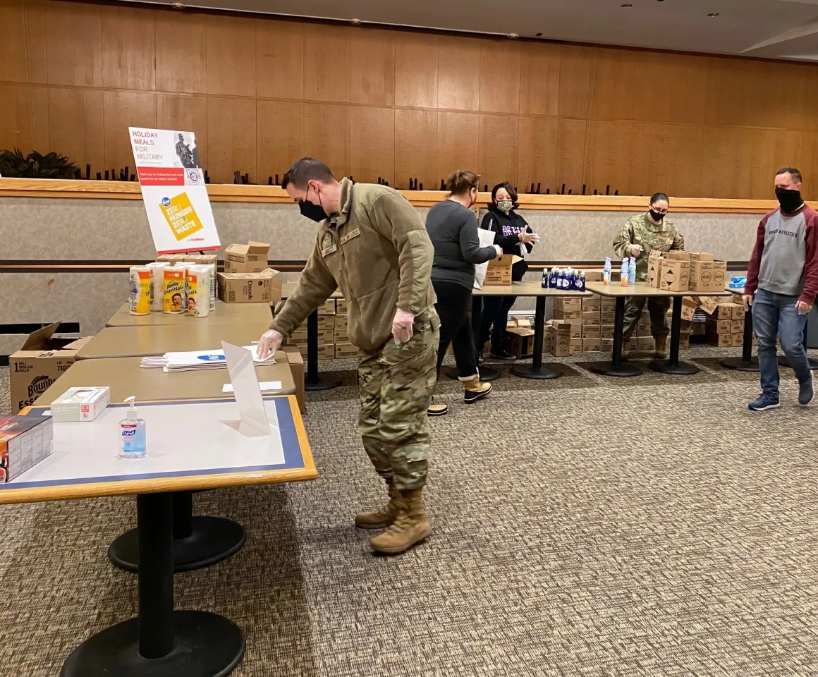 Veterans and volunteers at Holiday Meals for Military event